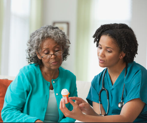 Nurse reviewing medication with a senior patient